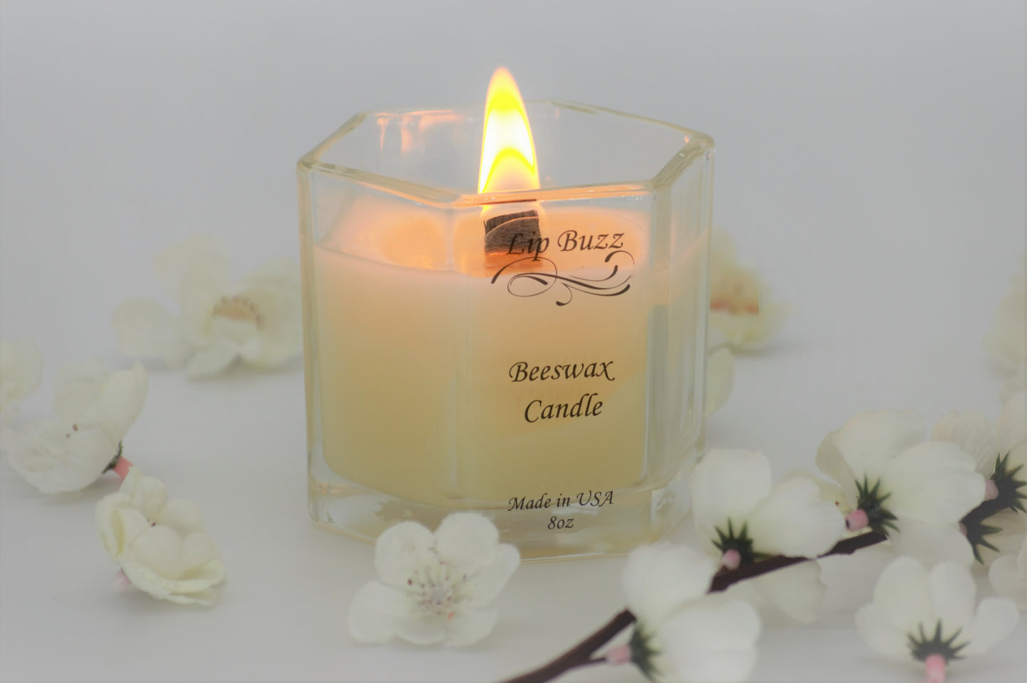 Burning beeswax candle